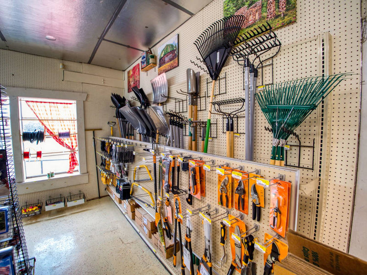 Garden tools supplies on display inside of Luther Hardware & Lumber.